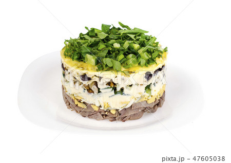 Portion salad with tongue on white plate Portion salad with tongue on white plate 47605038
