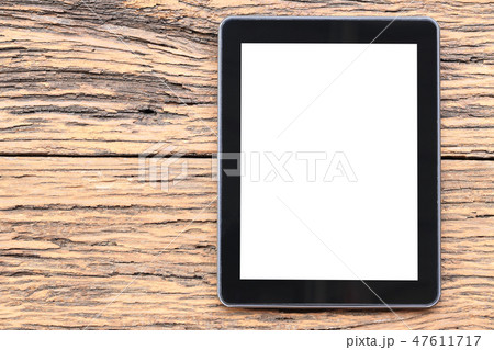 empty tablet on brown wooden floor and have copy space. 47611717