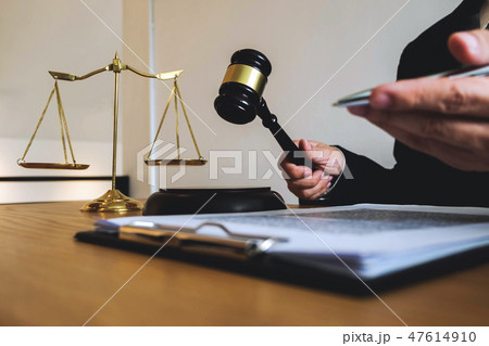 Lawyer working with contract client on the table. 47614910