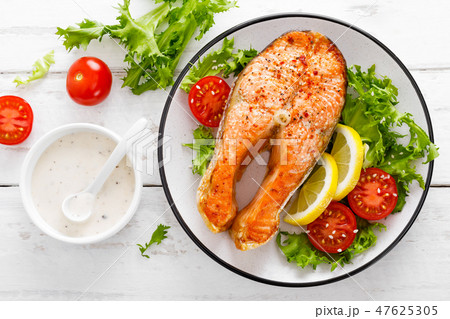 Salmon fish steak grilled and vegetable salad Salmon fish steak grilled and vegetable salad 47625305