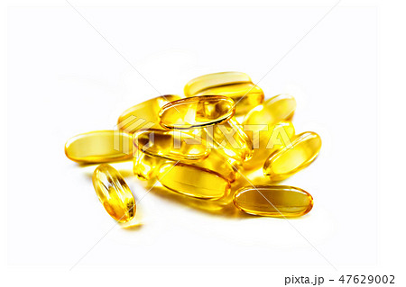 heap of fish oil supplement capsules 47629002
