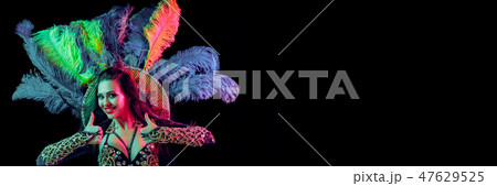 Beautiful young woman in carnival peacock costume 47629525