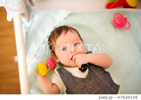 The kid woke up after a sweet dream 47630149