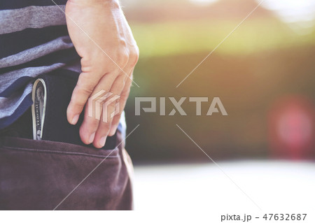 Confident man posing in save keeping your wallet  47632687