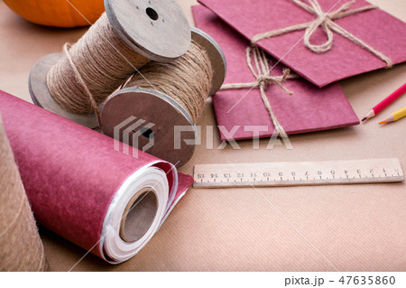 Gift wrapping set on pink. A set of items for gift decoration. Flat lay side view Gift wrapping set on pink. A set of items for gift decoration. Flat lay side view 47635860