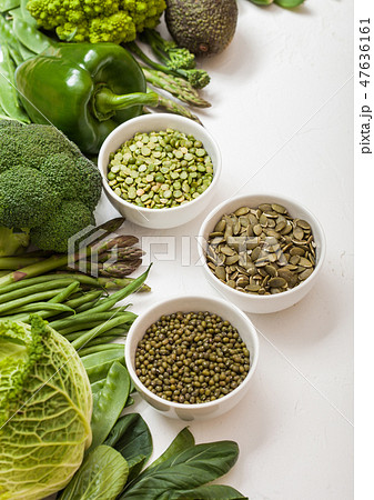 Assorted green toned raw organic vegetables Assorted green toned raw organic vegetables 47636161