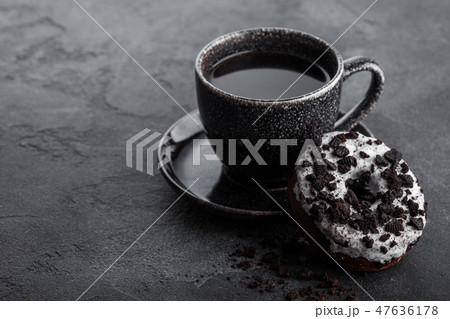 Black coffee cup with saucer and doughnut Black coffee cup with saucer and doughnut 47636178