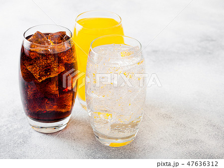 Glasses of soda drink with ice cubes and bubbles Glasses of soda drink with ice cubes and bubbles 47636312