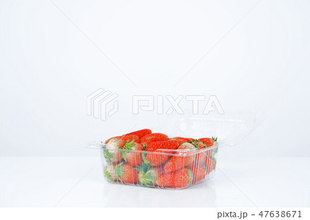 Plastic box with strawberries on white background. Plastic box with strawberries on white background. 47638671