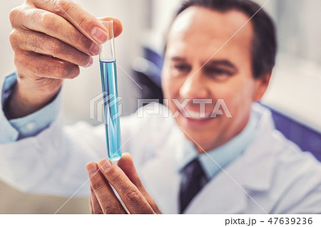 Clever medicine worker feeling happy after making breakthrough Clever medicine worker feeling happy after making breakthrough 47639236