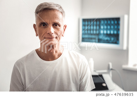 Hazel-eyed wrinkled man waiting for the doctor Hazel-eyed wrinkled man waiting for the doctor 47639635