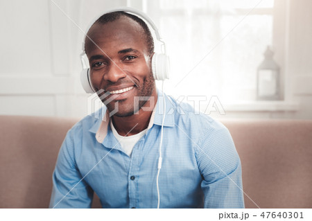 Nice cheerful man smiling to you Nice cheerful man smiling to you 47640301