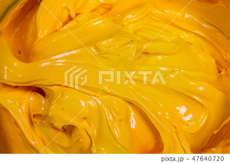 close up yellow color of oil paint. close up yellow color of oil paint. 47640720