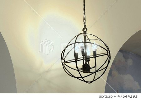 Unusual moderm lamp in the form of a metal ball with four lamps. 47644293