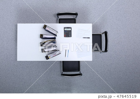 Binders with papers are waiting to be processed with bookkeeper. Internal Revenue Service inspector Binders with papers are waiting to be processed with bookkeeper. Internal Revenue Service inspector 47645519