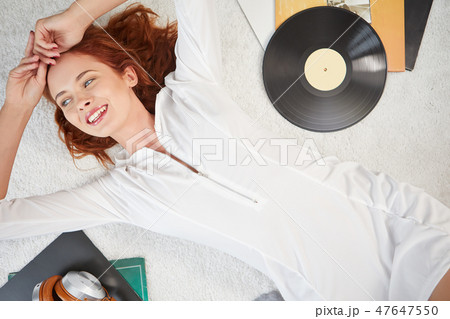 the image of resting sexy woman listening to vinyl 47647550