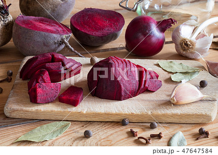 Sliced red beets with garlic and spices 47647584