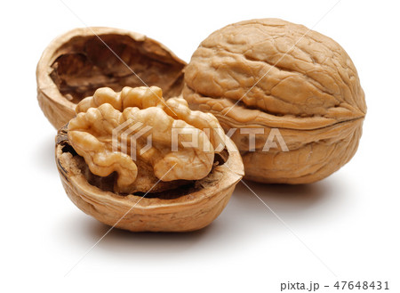 Walnuts and cracked walnut on white background Walnuts and cracked walnut on white background 47648431