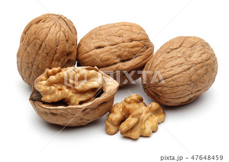 Walnuts and cracked walnut on white background 47648459