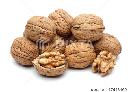 Walnuts and cracked walnut on white background Walnuts and cracked walnut on white background 47648460