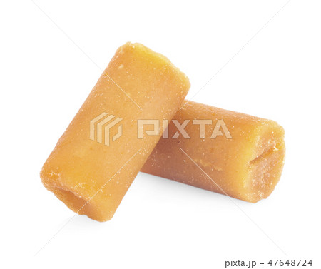 The palm sugar or Jaggery on white background The palm sugar or Jaggery on white background 47648724