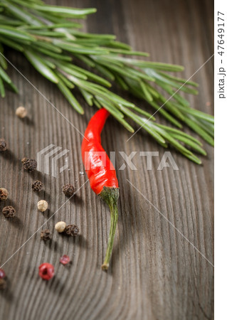 Rosemary and red hot chili pepper in a mortar Rosemary and red hot chili pepper in a mortar 47649177
