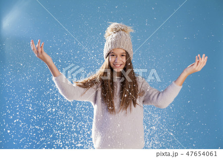 Portrait of beautiful girls under snow in winter 47654061