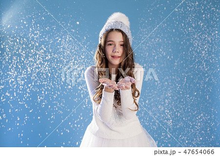 Portrait of beautiful girls under snow in winter 47654066