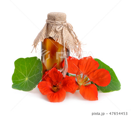 Nasturtium flowers with a pharmaceutical bottle. 47654453