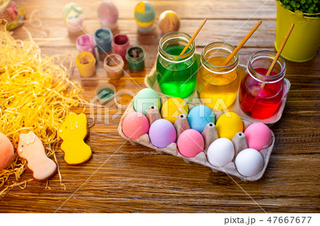 Happy Easter. Background with colorful eggs in basket. Table decorating for holiday. Top view. Happy Easter. Background with colorful eggs in basket. Table decorating for holiday. Top view. 47667677