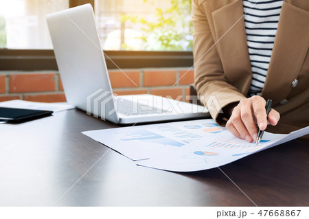 close up business executive working with laptop an data document close up business executive working with laptop an data document 47668867