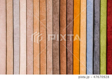 Colorful and bright fabric samples of furniture and clothing upholstery. Close-up of a palette of 47670928