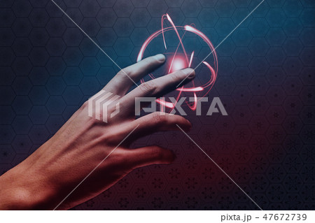 Human forefinger touches atom. Mixed media. 47672739