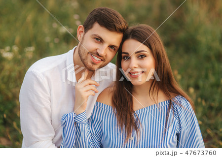 Portrait of man and woman. Background of grass. Happy family Portrait of man and woman. Background of grass. Happy family 47673760