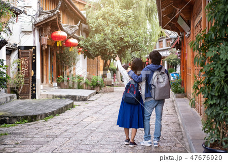Young couple traveler walking at lijiang old town Young couple traveler walking at lijiang old town 47676920