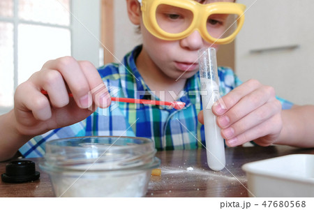 Experiments on chemistry at home. Chemical reaction with the release of gas in the test tube in the 47680568