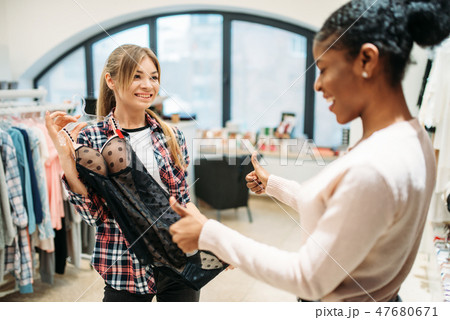 Two women choosing intimate apparel, shopping 47680671