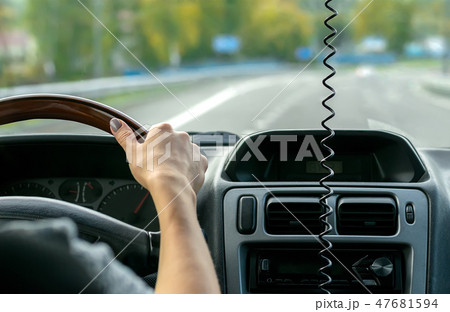 women's hands behind the wheel of a car women's hands behind the wheel of a car 47681594