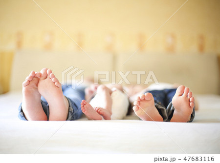 Sweet family in bed. Three sisters, close up  47683116