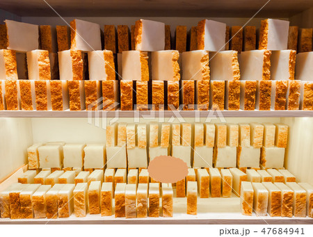 Bars of soap on a shop window. Turmeric soap with natural cedar oil and herbal ingredients. Handmade 47684941