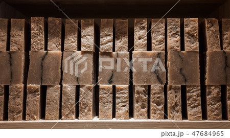 Bars of soap on a shop window. Coffee soap with natural cedar oil, turpentine and herbal ingredients 47684965