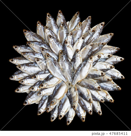 Large heap of dried salted sea roach laid out in t 47685411