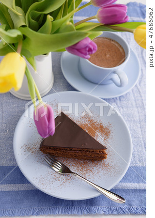 Chocolate cake, coffee and tulips 47686062