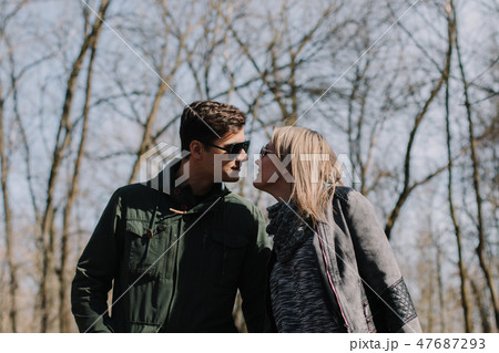 Cheerful loving each other couple kisses. Walk in Cheerful loving each other couple kisses. Walk in 47687293
