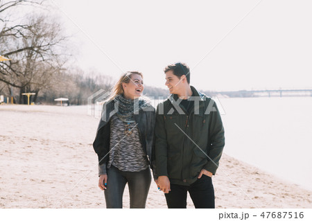 Cheerful loving each other couple kisses. Walk on 47687516