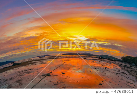 The curve of the horizon during the rising sun 47688011
