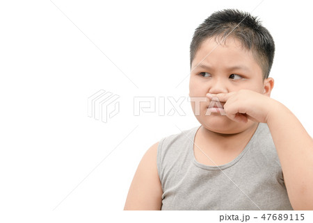 boy covering his nose because of a bad foul smell 47689115