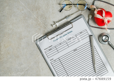 Patient progress note with stethoscope, red heart Patient progress note with stethoscope, red heart 47689159