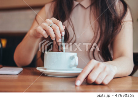 young woman girl with cup of coffee or tea 47690258