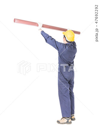 Plumber in uniform holding pvc pipe with clipping path 47692292